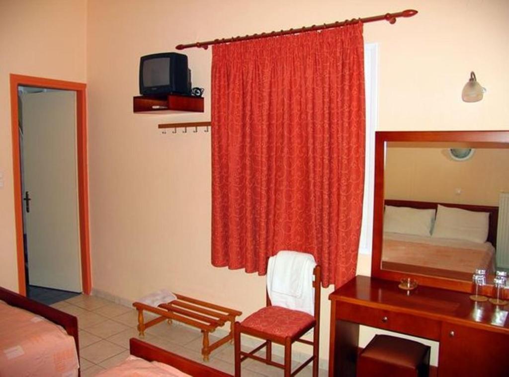 Apollon Hotel Tirós Rum bild